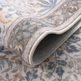 Covaba vintage floral bird rug in fern green, styled in a room setting
