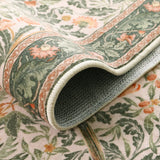 Covaba vintage floral bird rug in blush clay, styled in a room setting
