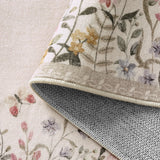 Covaba modern blooming floral garden rug in warm beige, styled in a room setting