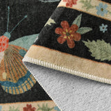 Covaba modern parisian insect rug in ink black, styled in a room setting