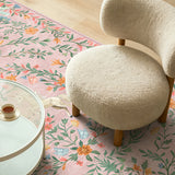 Covaba fantasy garden and unicorn area rug in blush clay, styled in a room setting, view 6