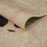 Covaba modern safari leopard rug in warm beige, styled in a room setting