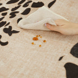 Covaba modern safari leopard rug in warm beige, styled in a room setting, view 2
