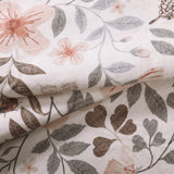Covaba vintage botanical floral rug in warm beige, styled in a room setting