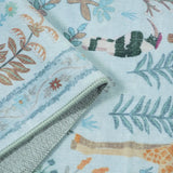 Covaba jungle animals rug in stormy blue, styled in a room setting, view 2