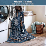 Covaba jungle animals rug in deep navy, styled in a room setting