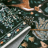Covaba jungle animals rug in fern green, styled in a room setting, view 2