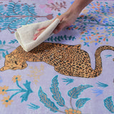 Covaba jungle animals rug in muted plum, styled in a room setting, view 2