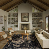 Covaba mystical snake area rug in ink black, styled in a room setting, view 7