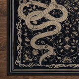 Covaba mystical snake rug in ink black, styled in a room setting