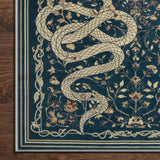 Covaba mystical snake rug in stormy blue, styled in a room setting, view 6
