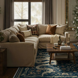 Covaba mystical snake rug in stormy blue, styled in a room setting, view 5