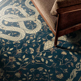 Covaba mystical snake rug in stormy blue, styled in a room setting, view 7