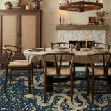 Covaba mystical snake rug in stormy blue, styled in a room setting, view 2