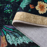 Covaba vintage botanical insect rug in stormy blue, styled in a room setting, view 2