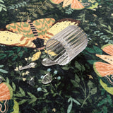 Covaba vintage botanical insect rug in fern green, styled in a room setting