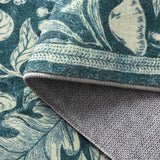Covaba vintage woodcut forest and rabbit rug in stormy blue, styled in a room setting