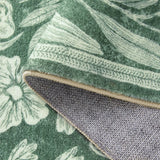 Covaba vintage woodcut forest and rabbit rug in fern green, styled in a room setting