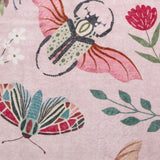 Covaba modern parisian insect rug in blush clay, styled in a room setting, view 2