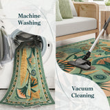 Covaba egyptian-inspired botanical rug in fern green, styled in a room setting