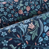 Covaba maximalism vibrant floral rug in stormy blue, styled in a room setting, view 2