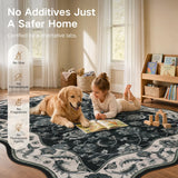 Covaba vintage botanical scalloped rug in ink black, styled in a room setting, view 3