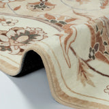 Covaba vintage botanical scalloped rug in warm beige, styled in a room setting, view 2