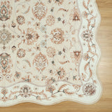 Covaba vintage botanical scalloped rug in warm beige, styled in a room setting
