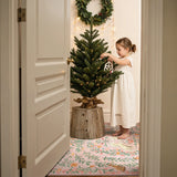 Covaba fantasy garden and unicorn rug in blush clay, styled in a room setting