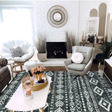 Covaba modern rustic farmhouse moroccan tribal black/white area rug in soft white, styled in a room setting, view 5