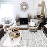 Covaba modern rustic farmhouse moroccan tribal grey/white area rug in soft white, styled in a room setting, view 2