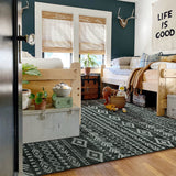 Covaba modern rustic farmhouse moroccan tribal black/white area rug in soft white, styled in a room setting, view 4