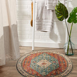 Covaba boho vintage tribal round rug in burnt rust, styled in a room setting, view 3