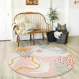 Covaba modern botanical leaf round rug in blush clay, styled in a room setting, view 5