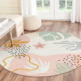 Covaba modern botanical leaf round rug in blush clay, styled in a room setting