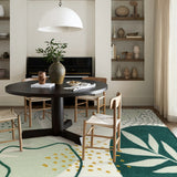 Covaba modern botanical leaf area rug in fern green, styled in a room setting, view 11