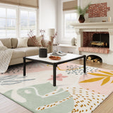 Covaba modern botanical leaf area rug in blush clay, styled in a room setting, view 6