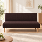 Front view of the espresso sofa bed cover on an armless sofa bed in a bright living room
