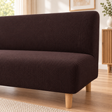 Underside of the espresso sofa bed cover showing the elastic band that holds it in place