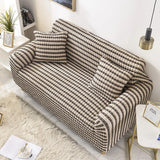 Black & Sand Bubble sofa cover draped over a three-seater sofa in a bright living room