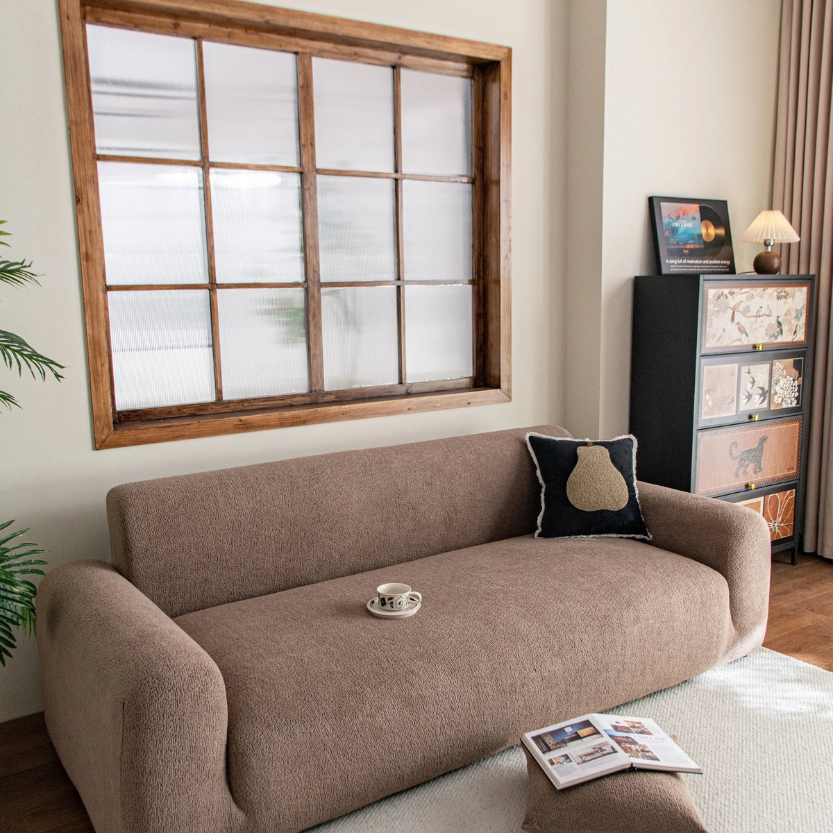 Brown Chenille sofa cover draped over a three-seater sofa in a bright living room, view 2