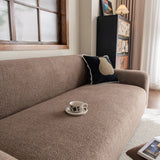 Brown Chenille sofa cover styled with cushions on a low-back sofa, view 2