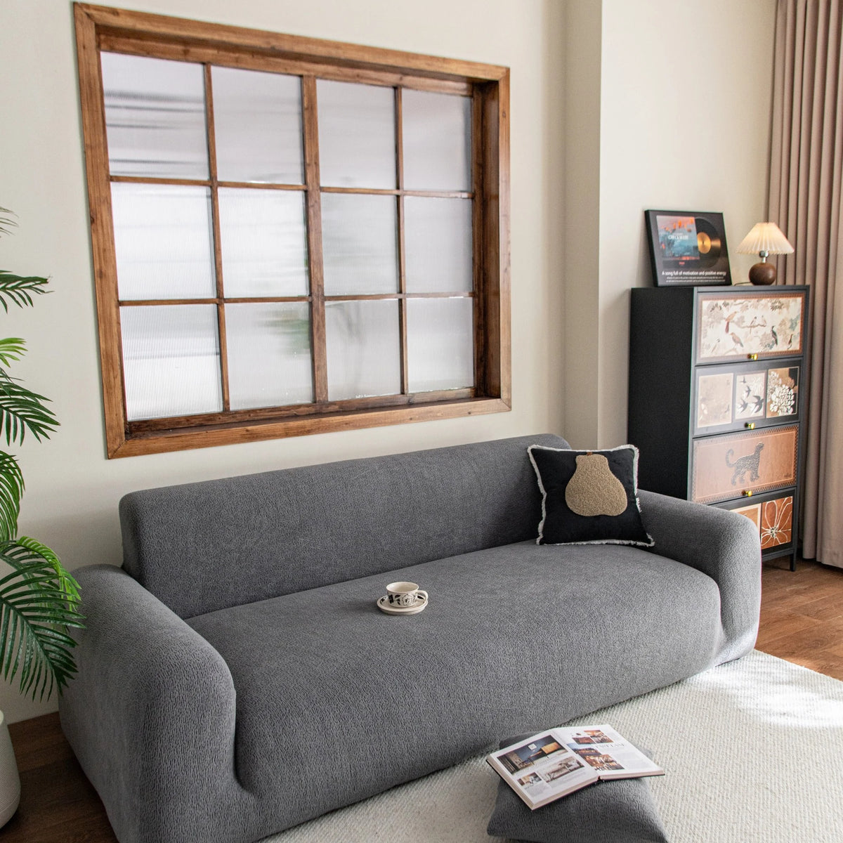 Stone Grey Chenille sofa cover draped over a three-seater sofa in a bright living room, view 5