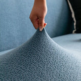 Stormy Blue Chenille sofa cover seen from the side on a corner sofa