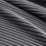 Grey Corduroy sofa cover photographed at an angle beside a floor lamp