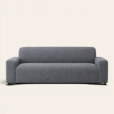 Grey Corduroy sofa cover on a plain studio background