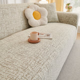 Boucle-Style Sand Jacquard sofa cover, woven texture in close-up, view 2