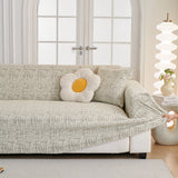 Boucle-Style Sand Jacquard sofa cover seen from the side on a corner sofa, view 2