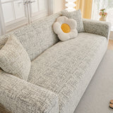 Stone Grey Jacquard sofa cover seen from the side on a corner sofa, view 3