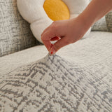 Stone Grey Jacquard sofa cover styled with cushions on a low-back sofa, view 3